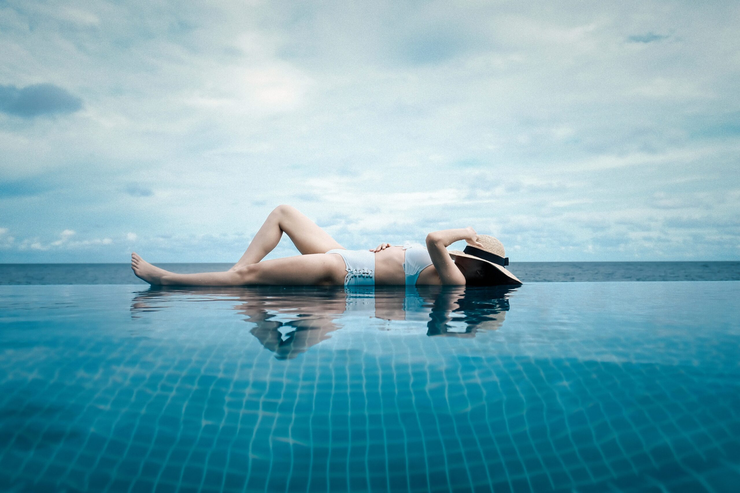 woman lying in a pool